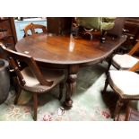 Edwardian mahogany dining room table on carved legs.