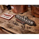 Two advertising plaques - Paddy Old Irish Whiskey and Guinness.