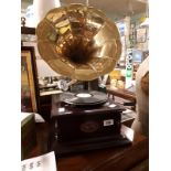 Gramophone with brass horn.