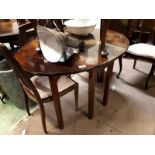 Georgian mahogany double drop leaf table raised on square legs.