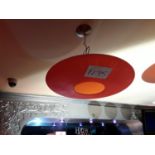 A disc shaped light fitting with opening