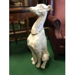 Seated whippet with gilded collar