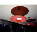 A disc shaped light fitting with opening