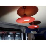 A disc shaped light fitting with opening