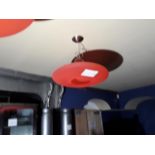 A disc shaped light fitting with opening