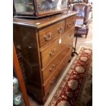 Mahogany chest of drawers with three long drawers of two short drawers.