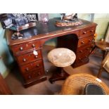 Victorian mahogany desk with tooled leather top.