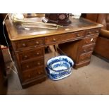 Victorian tooled leather topped kneehole desk.