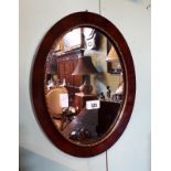 Victorian rosewood oval mirror.