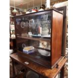 Mahogany display cabinet with central CADBURY's CHOCOLATE glass panel.