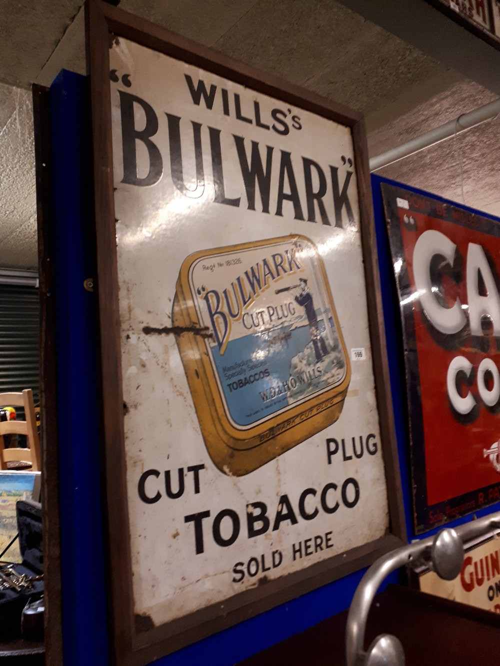 Framed WILLS's BULWARK TOBACCO PLUG enamel sign