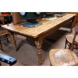 Stripped Pine kitchen table with four turned legs. (96 cm L x 41 cm W x 31 cm H).