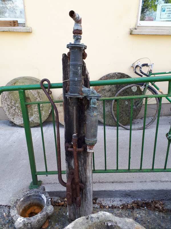 Early 20th. C. brass and metal water pump.