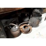Collection of metal kettles and pots.