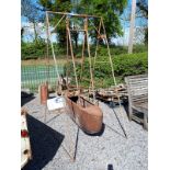 Metal swing boat.