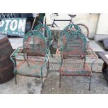 Set of four metal garden chairs.