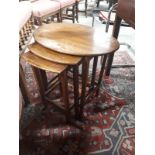 Nest of three mahogany tables.