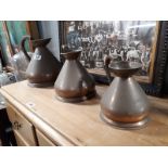 Set of three copper haystack measures.