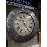 Large industrial wall clock.