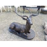 Cast iron model of a stag seated.