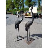 Pair of bronze models of STORKS.