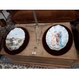 Two large mounted plates one of Dutch scene and one of Eastern scene.