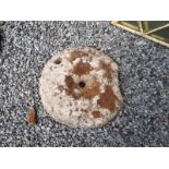 Medieval carved sandstone quern stone.