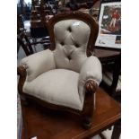 Carved mahogany upholstered child's armchair.