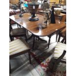 Regency style inlaid mahogany dining table with four outswept feet. (150 cm L x 90 cm W).