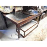 19th. C. mahogany writing desk with tooled leather top raised on four turned legs.