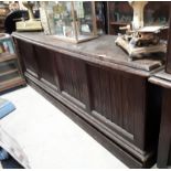 Late 19th. C. mahogany D- end shop counter with panelled front. { 96cm H X 282cm L X 68cm D }.