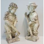 Two Stone Garden Figures of young boys, 31.5ins (h).
