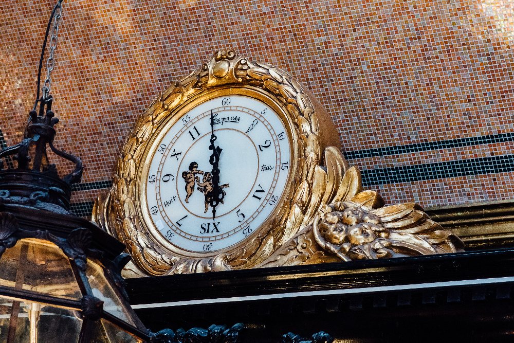 Large gilded pediment clock with glass face in the Rococo style. { 35'' H X 62'' W }.