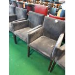 Set of six upholstered arm chairs.