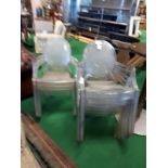 Set of eight plastic outdoor chairs.