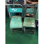 Set of eleven green metal garden chairs.