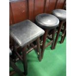 Five leather top wooden pub stools.