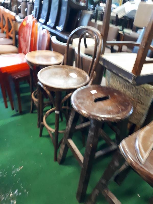 Seventeen various pub stools.