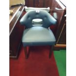 Ex Shelbourne blue leather tub chair.
