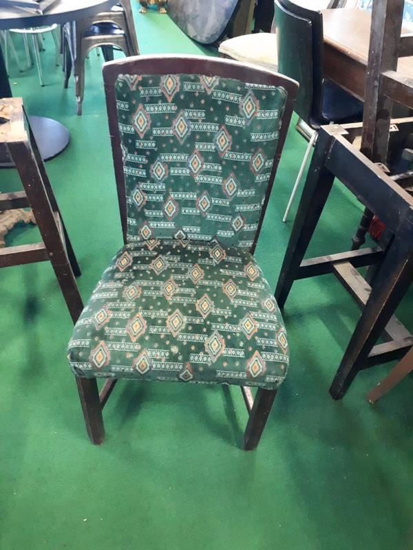 Twelve upholstered restaurant dining chairs.