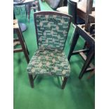 Twelve upholstered restaurant dining chairs.