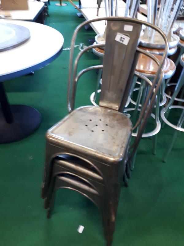 Set of seven metal patio chairs.