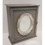 Grey Wall Cabinet with cream oval mirrored front inset, 12.25 x 10.25 x 5ins deep.