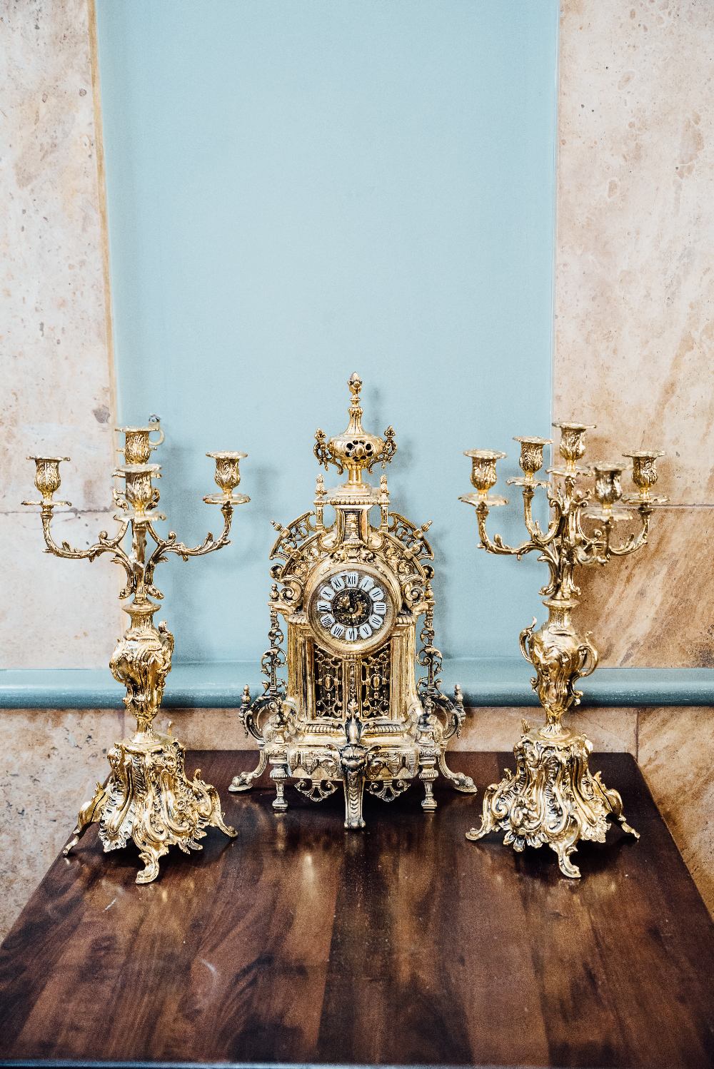Three piece brass clock garniture in the Rococo style. { 20'' H X 9'' W }.