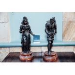 Pair of bronzed figures in the Classical style.