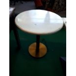 Eight marble top restaurant tables.