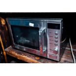 Sharp 1000Watt microwave. { 13'' H X 20'' W }.