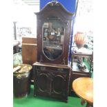 Carved mahogany single door bookcase.