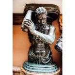 Green patinated bronze figure holding a planter aloft in the Classical style. { 51'' H X 36'' W }.