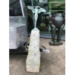 Winged bronze sculpture of a Women on tapering granite plinth.